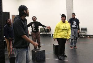 The cast of Reparations in rehearsal