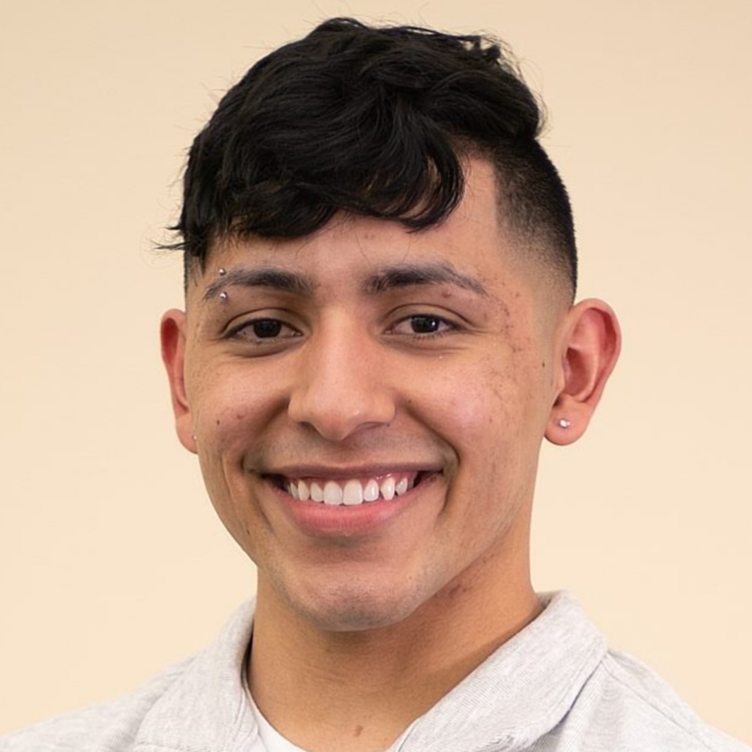 [ID: headshot of Malik Cantú. End ID.]